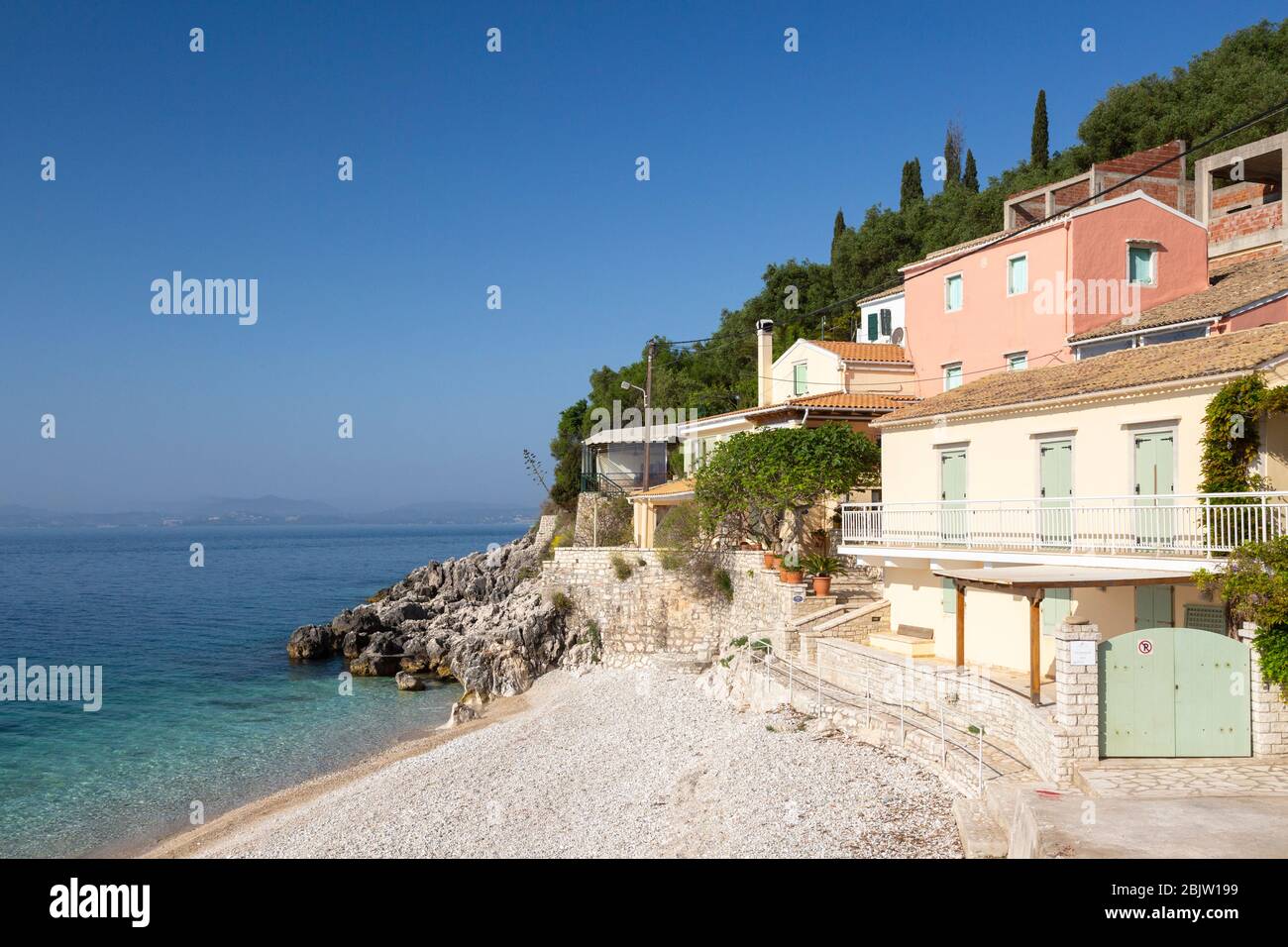 Kaminaki Beach with houses, Corfu, Greece Stock Photo Alamy