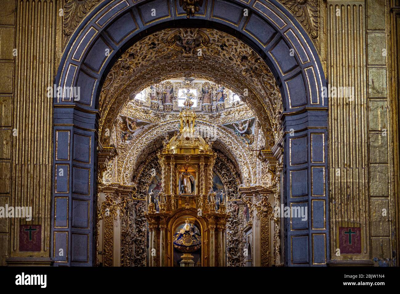 Inside Gold-covered baroque masterpiece Chapel of the Rosario inside Church of Santo Domingo de Guzman, Puebla, Mexico Stock Photo