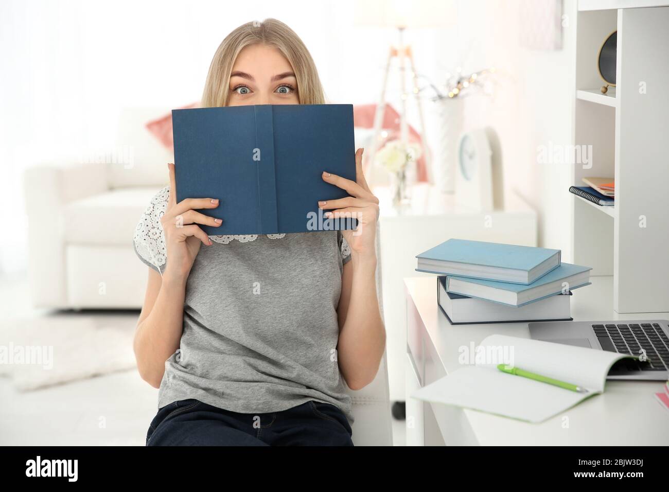 Female student preparing for exam indoors Stock Photo