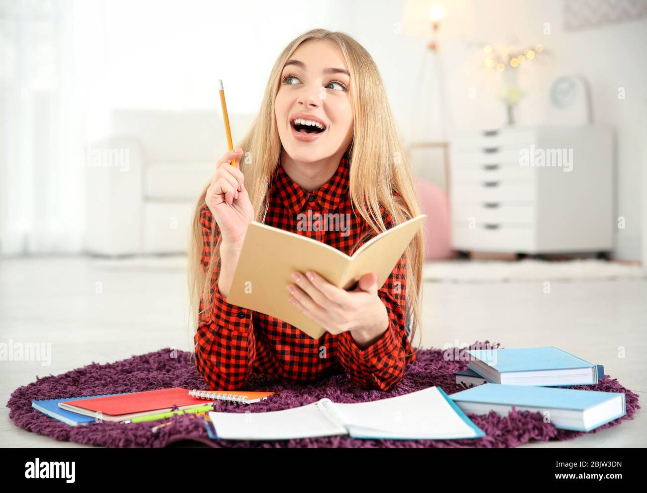 Female student preparing for exam indoors Stock Photo
