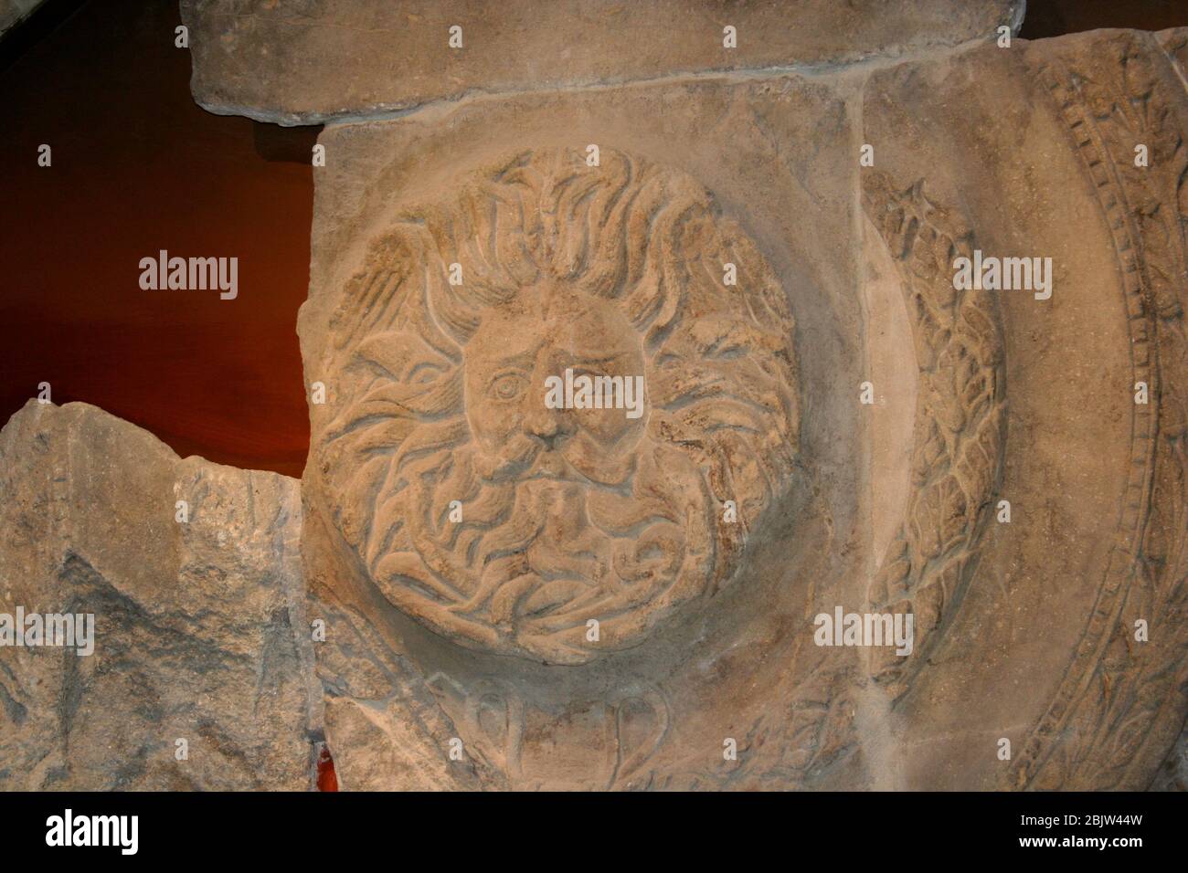 Roman stone carving of the head Roman baths bath England UK
