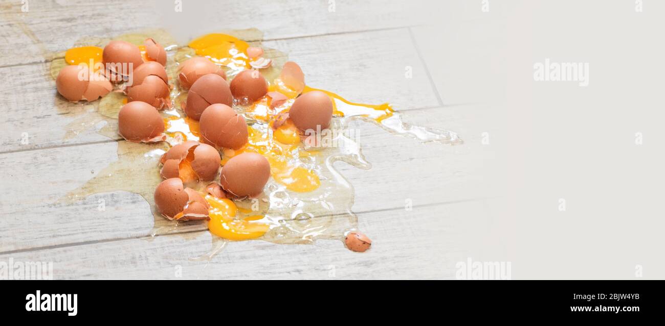 Eggs broken on the  floor background Stock Photo
