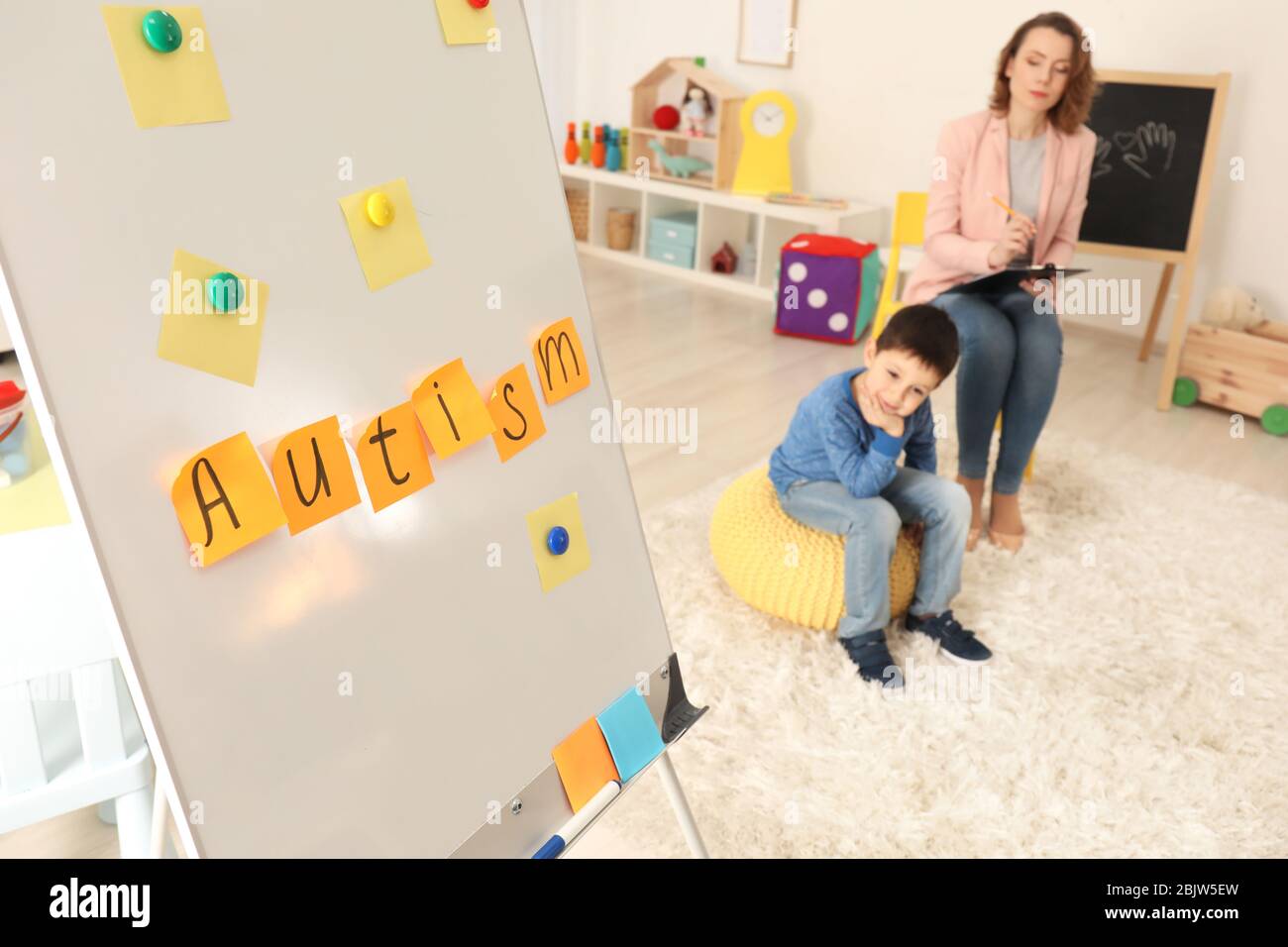 Board with sticky notes at child psychologist's office. Autism concept