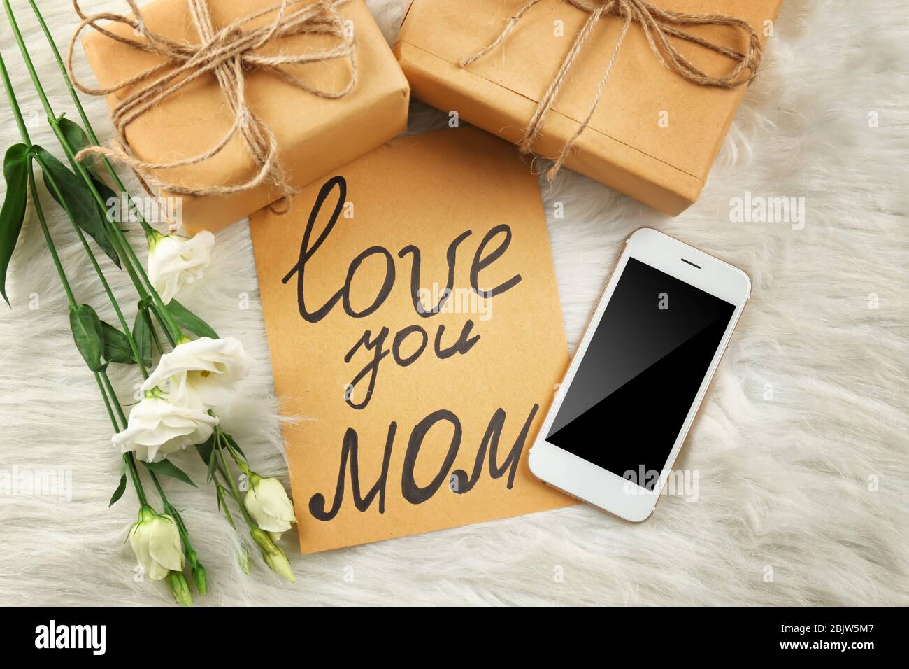 Gift Boxes Card With Text Love You Mom Smartphone And Flowers On Furry Background Mother S Day Celebration Stock Photo Alamy Gift Boxes Card With Text Love You Mom Smartphone And Flowers On Furry Background Mother S Day Celebration Stock Photo Alamy