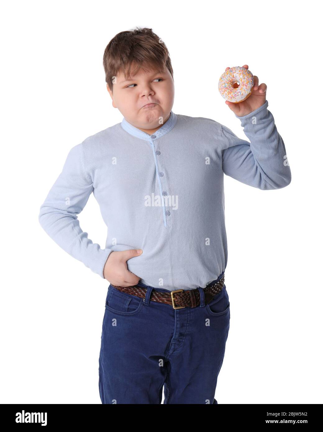 Overweight boy with doughnut on white background Stock Photo