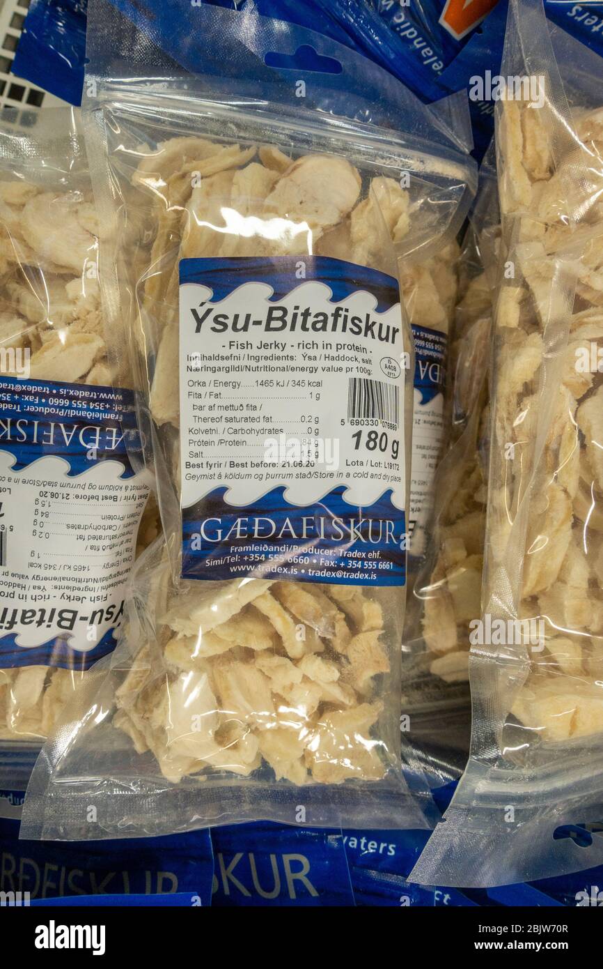 Ysu-bitafiskur (Ýsa or haddock) fish jerky packet on a service station/petrol station shop rack, Borgarnes, Iceland. Stock Photo