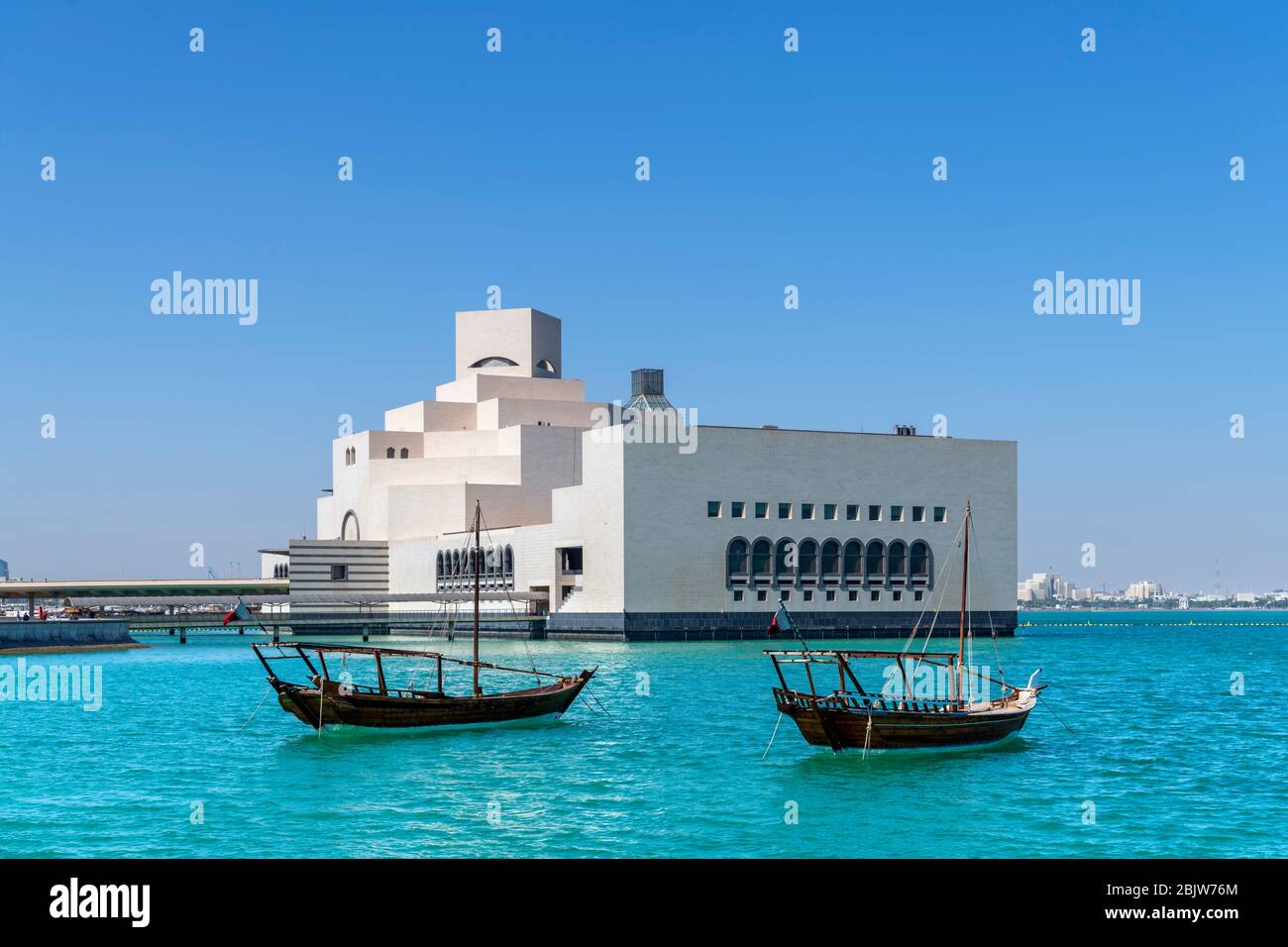 The Museum of Islamic Art from MIA Park with dhows in the foreground, Doha, Qatar, Middle East Stock Photo