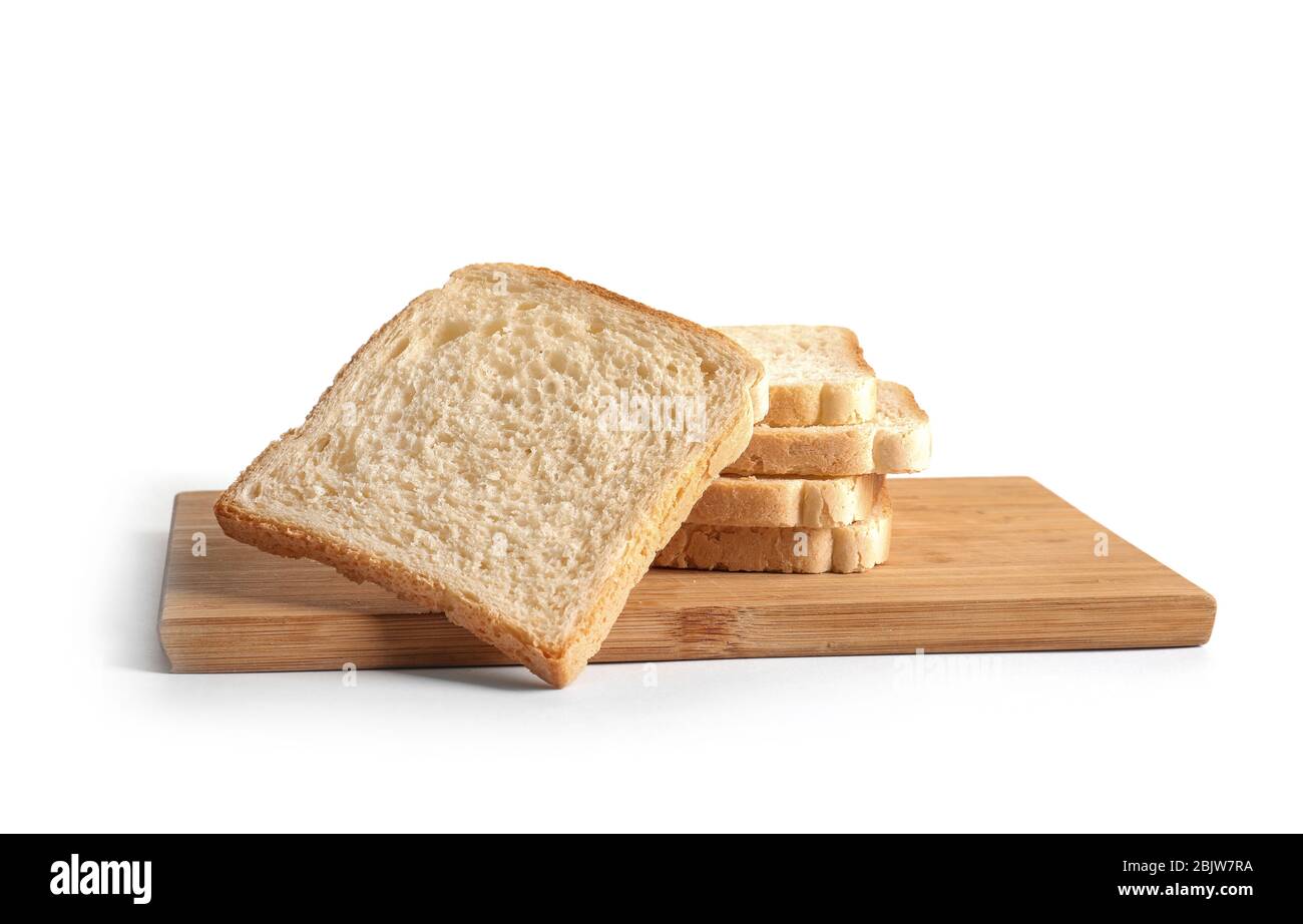 Wooden board with slices of bread for toasting on white background ...