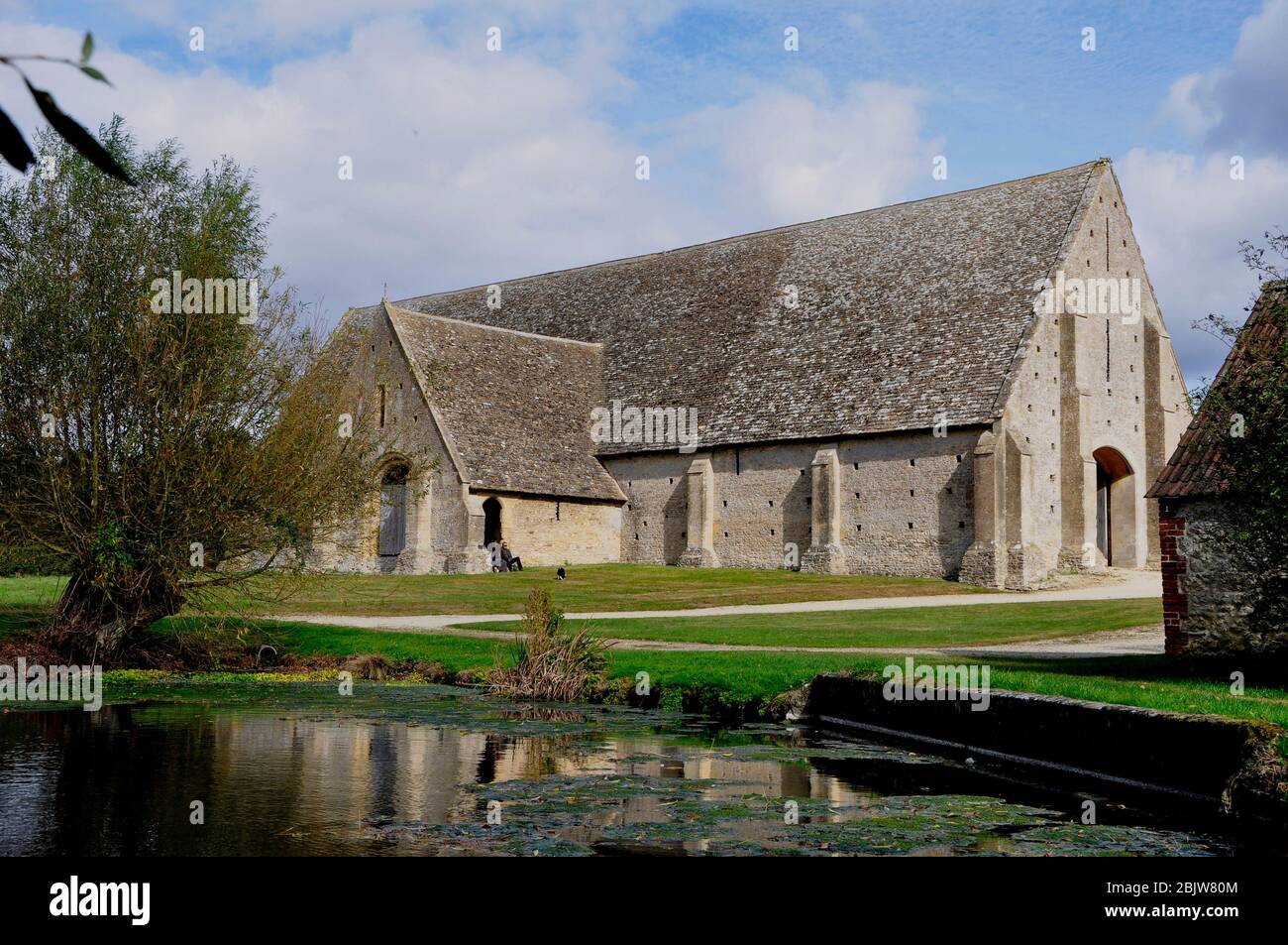 Great Coxwell tithe barn; built about 1292 for the Cistercian Beaulieu Abbey in Hampshire; which had held the manor of Great Coxwell since 1205.Stone Stock Photo