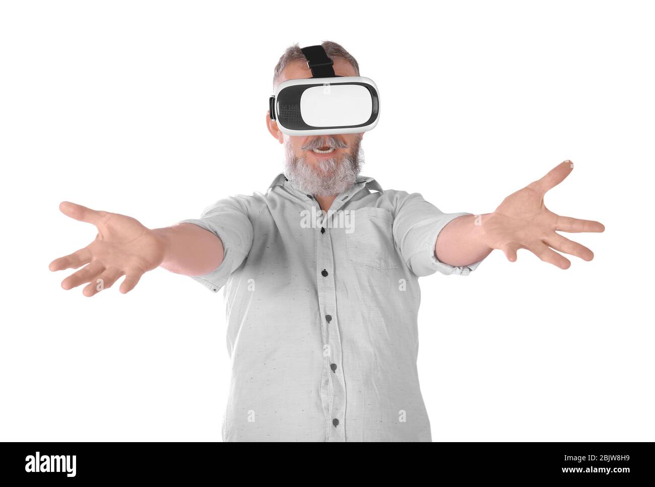 Senior man with virtual reality headset on white background Stock Photo ...
