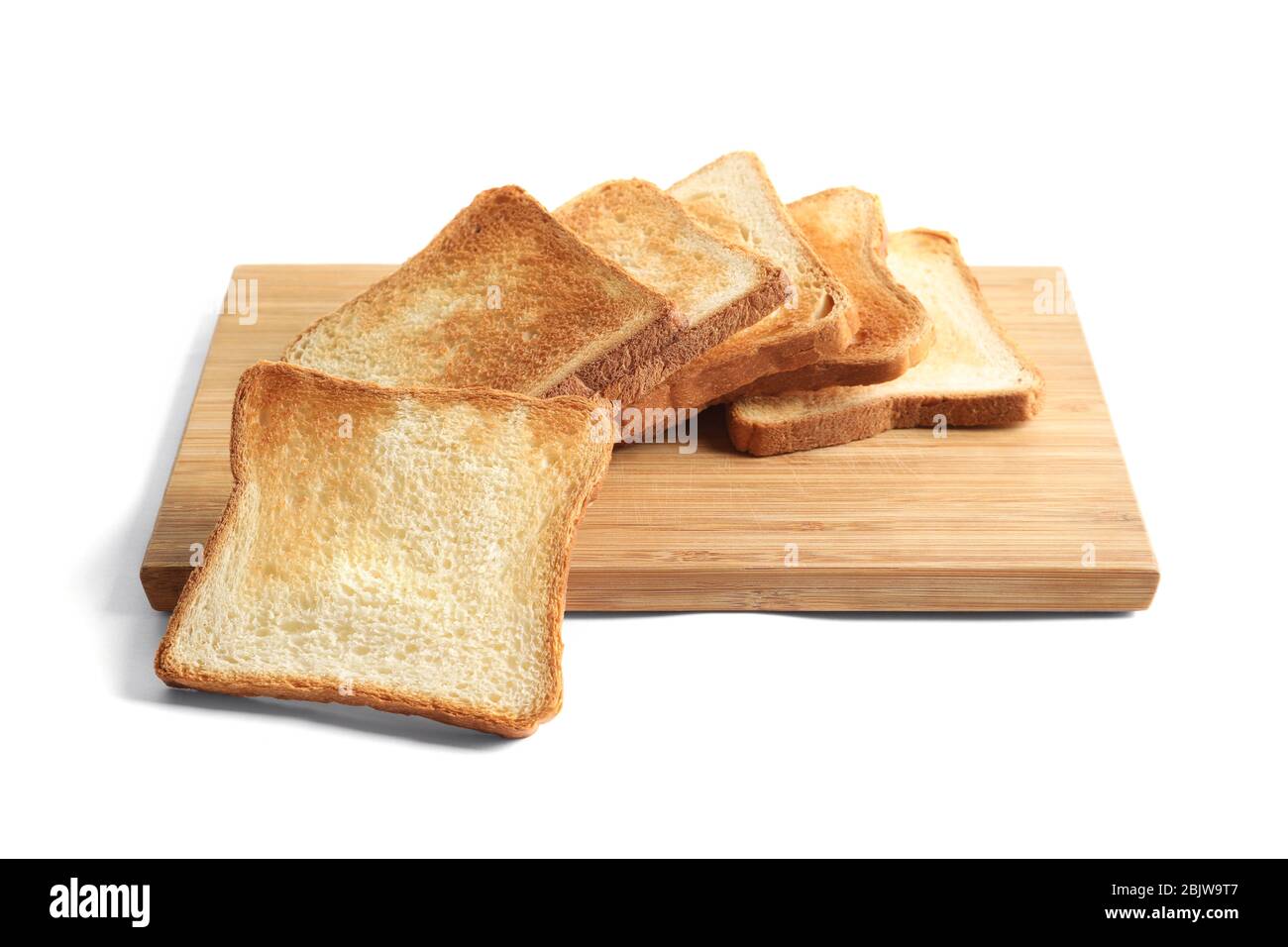 Wooden board with toasted bread on white background Stock Photo - Alamy