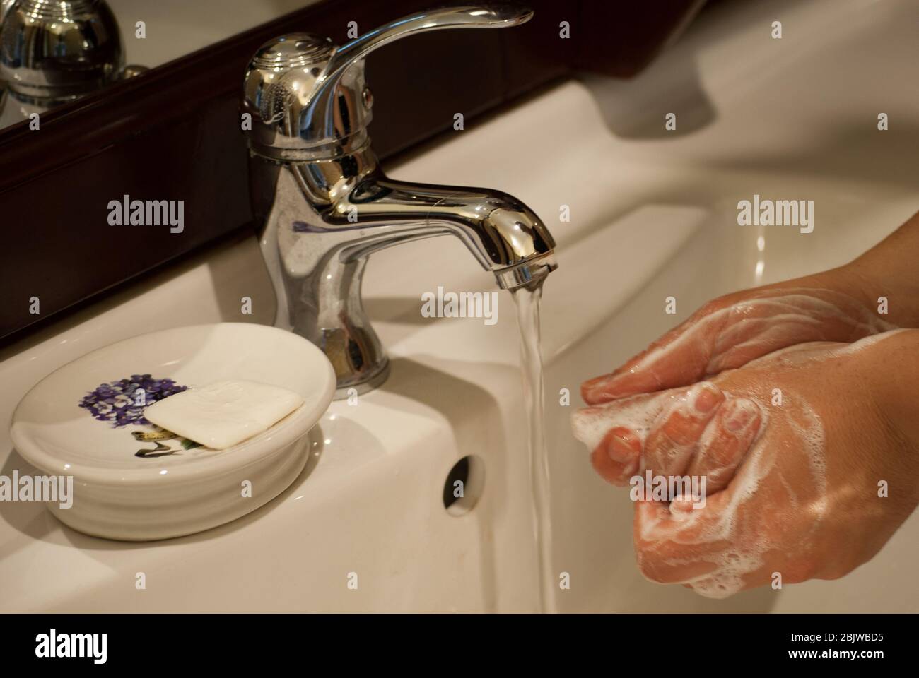Washing hands carefully: one of the best way to prevent coronavirus transmission. Stock Photo
