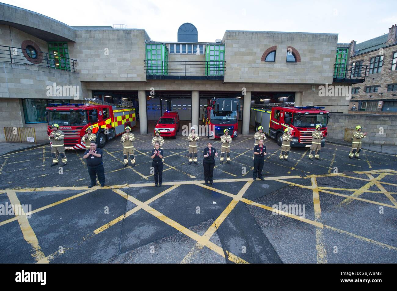 Edinburgh, UK. 30th Apr, 2020. Pictured: Scottish Fire and Rescue Service emergency workers show their appreciation during the 'Clap for Our Carers' campaign - a weekly tribute to thank NHS and key workers during thee coronavirus (COVID-19) outbreak. The public are being encouraged to applaud NHS staff and other key workers from their homes every Thursday at 8pm. To date the Coronavirus (COVID-19) pandemic has infected over 3.21 million people globally, and in the UK infected over 171, 00 and killed 26,711. Credit: Colin Fisher/Alamy Live News Stock Photo