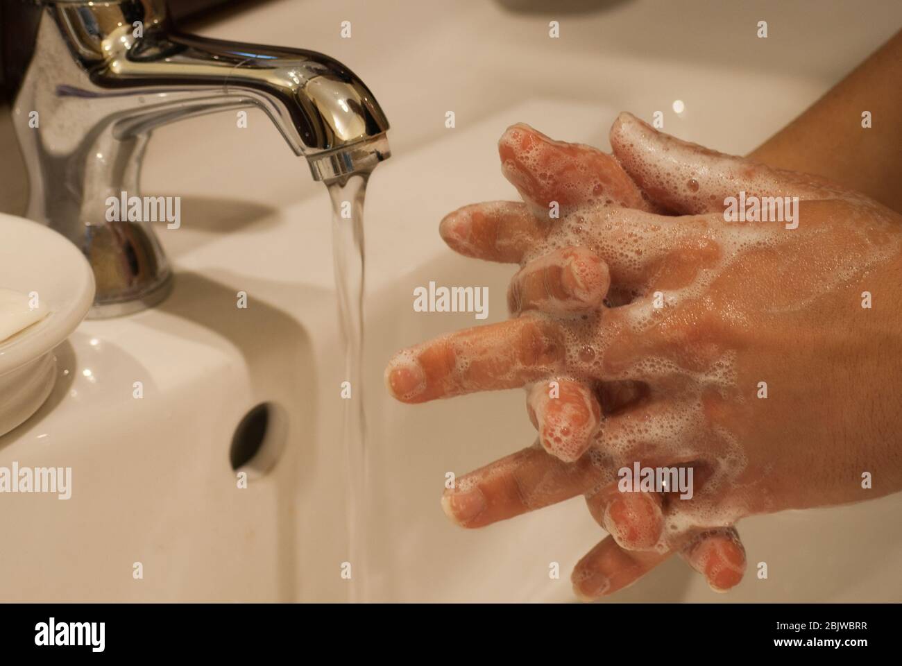 Washing hands carefully: one of the best way to prevent coronavirus transmission. Stock Photo