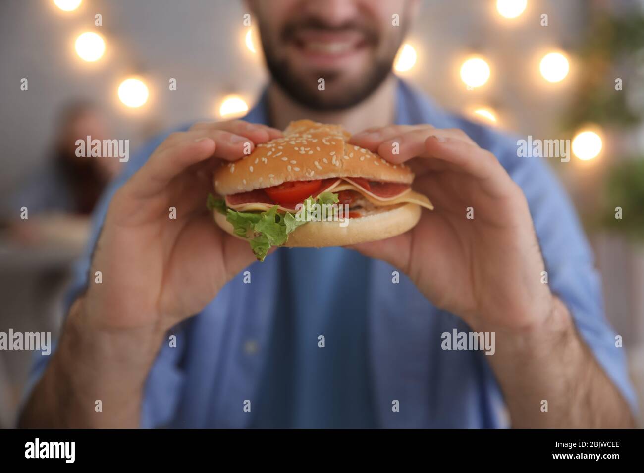 Bearded man eating burger in hi-res stock photography and images - Alamy