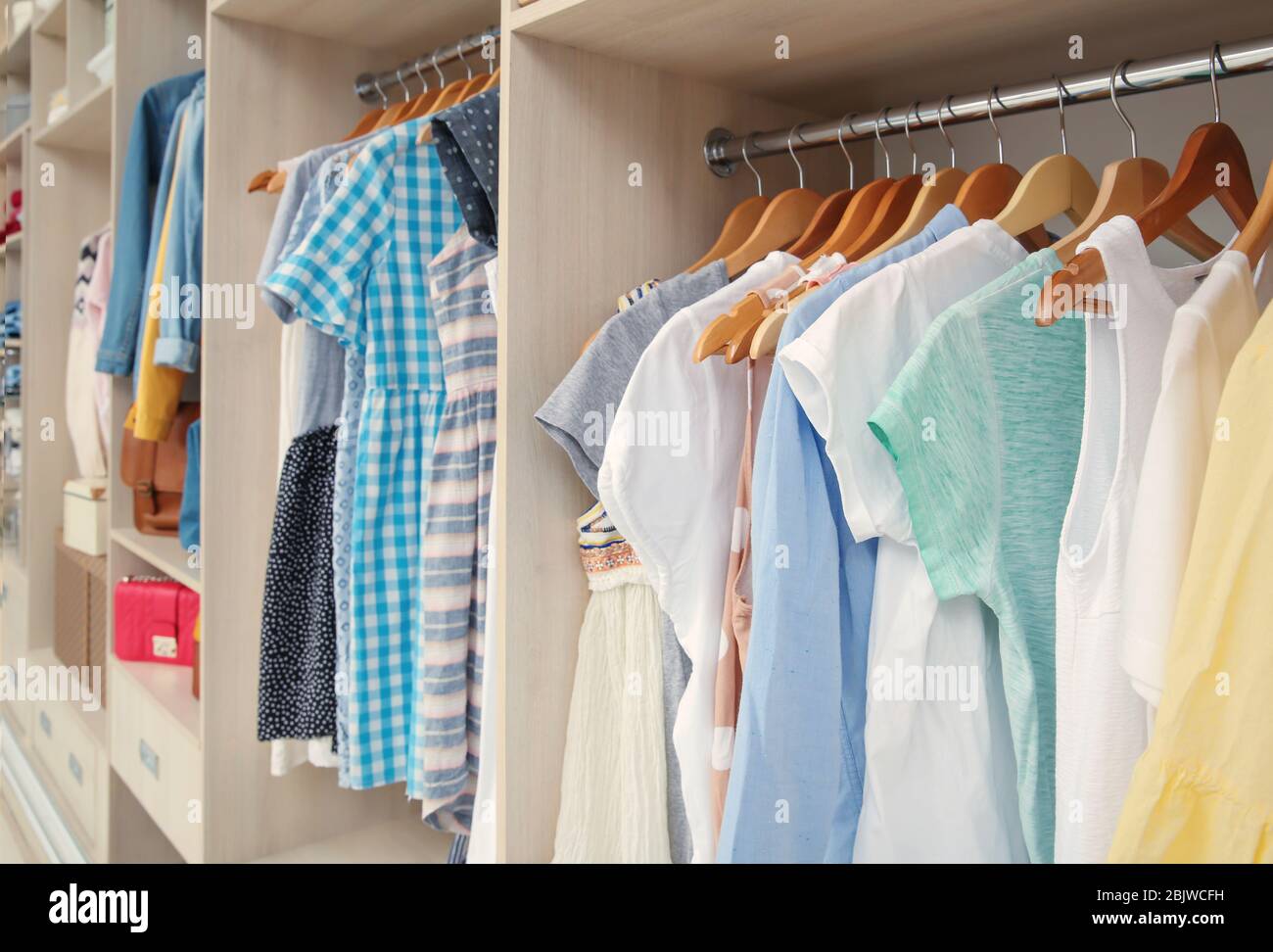 Large wardrobe with female clothes in dressing room Stock Photo Alamy