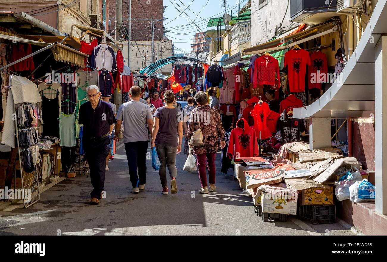 Traditional street market in one of the narrow street of Tirana, Albania. The locals sell their commodity. Stock Photo