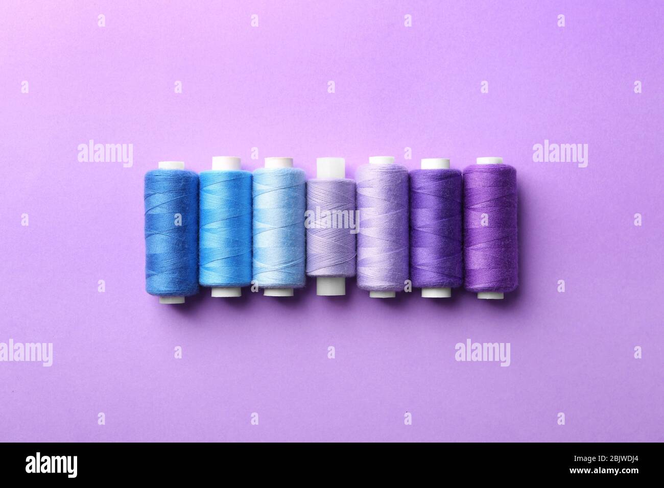 Thread Top View Set of sewing threads on color background, top view Stock Photo - Alamy