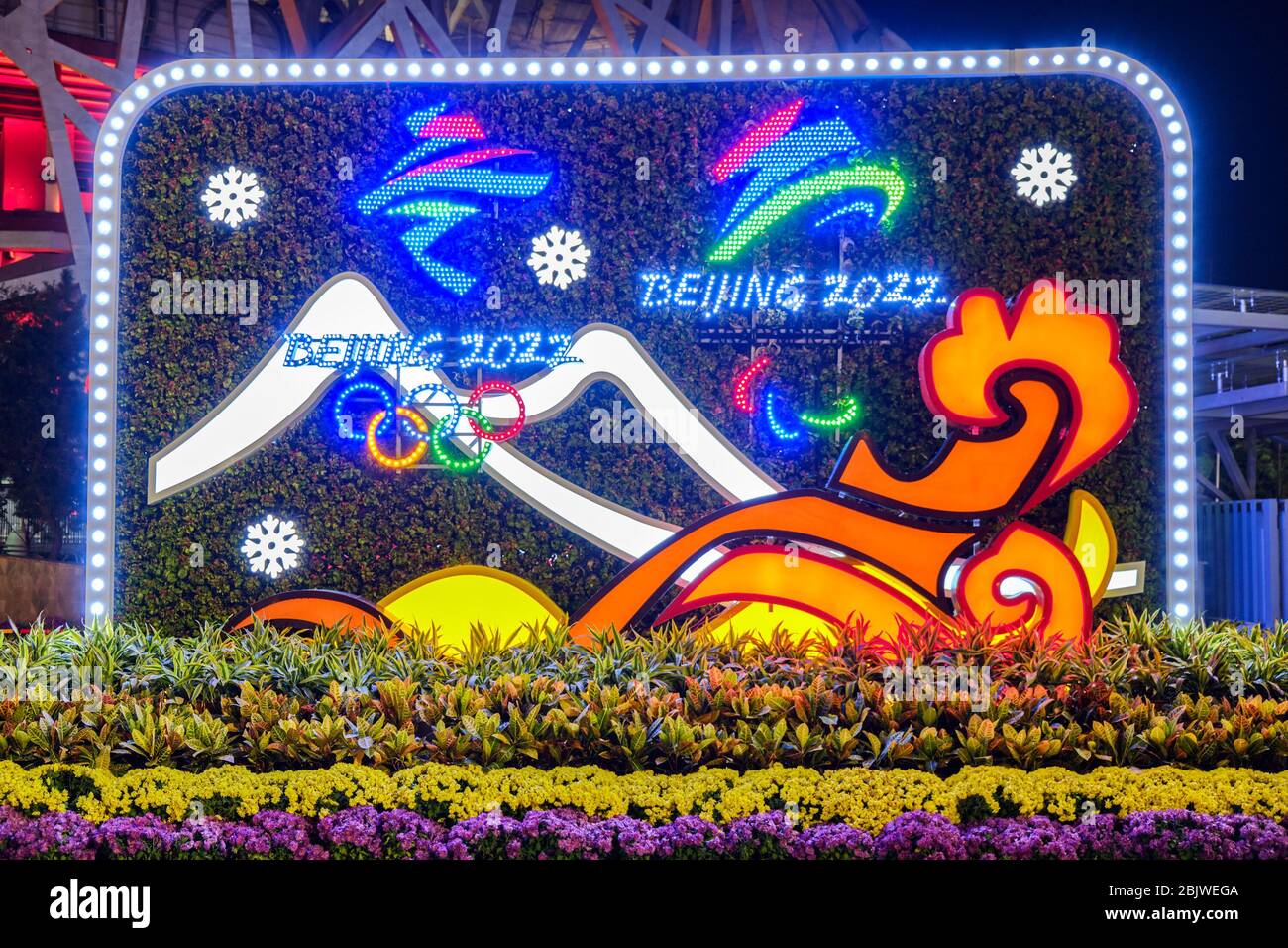 Beijing / China - October 11, 2018: Decorative stand promoting the Beijing Winter Olympics 2022 in front of the Beijing National Stadium ('The Bird's Stock Photo