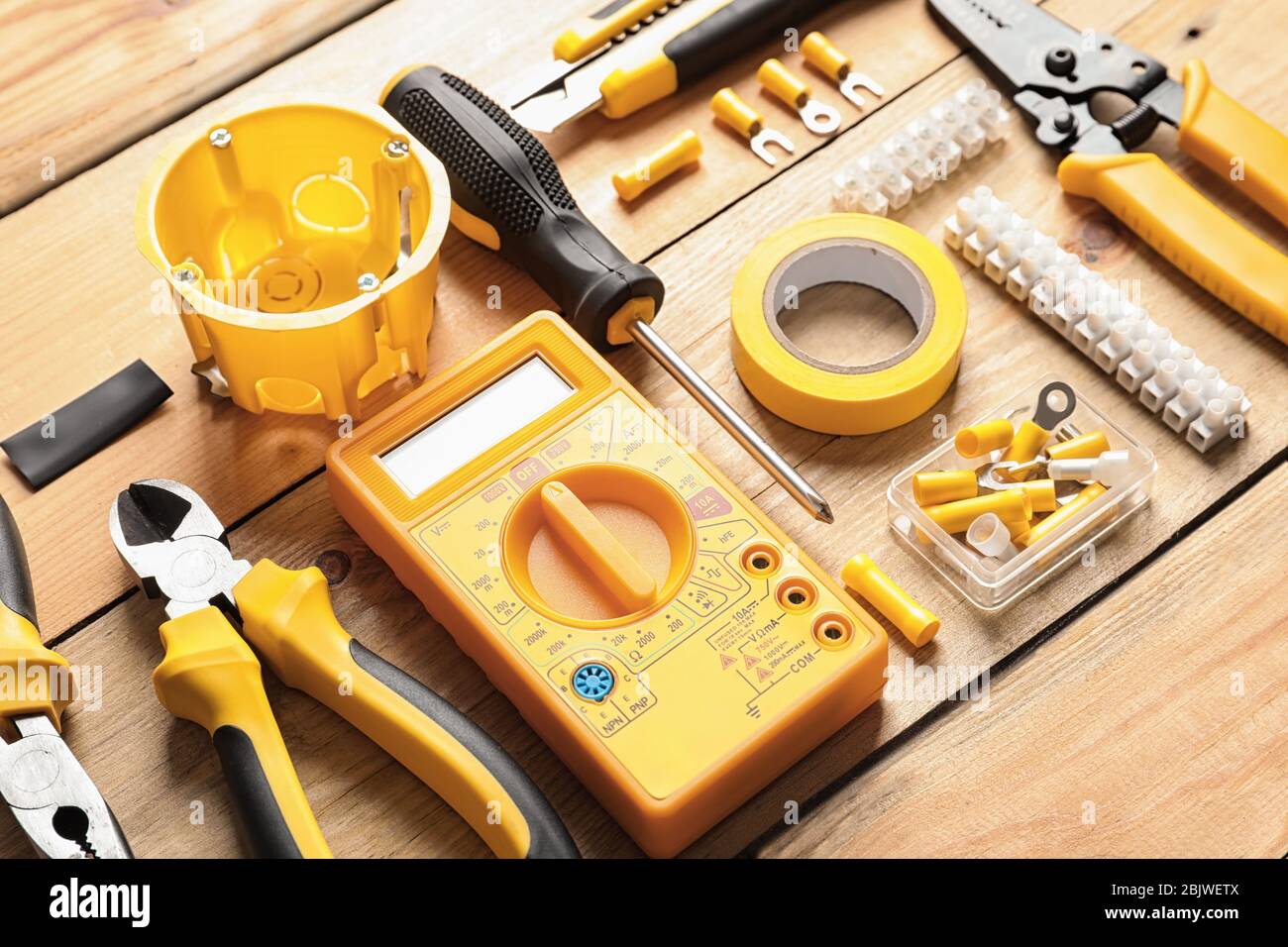 Different electrical tools on wooden background Stock Photo