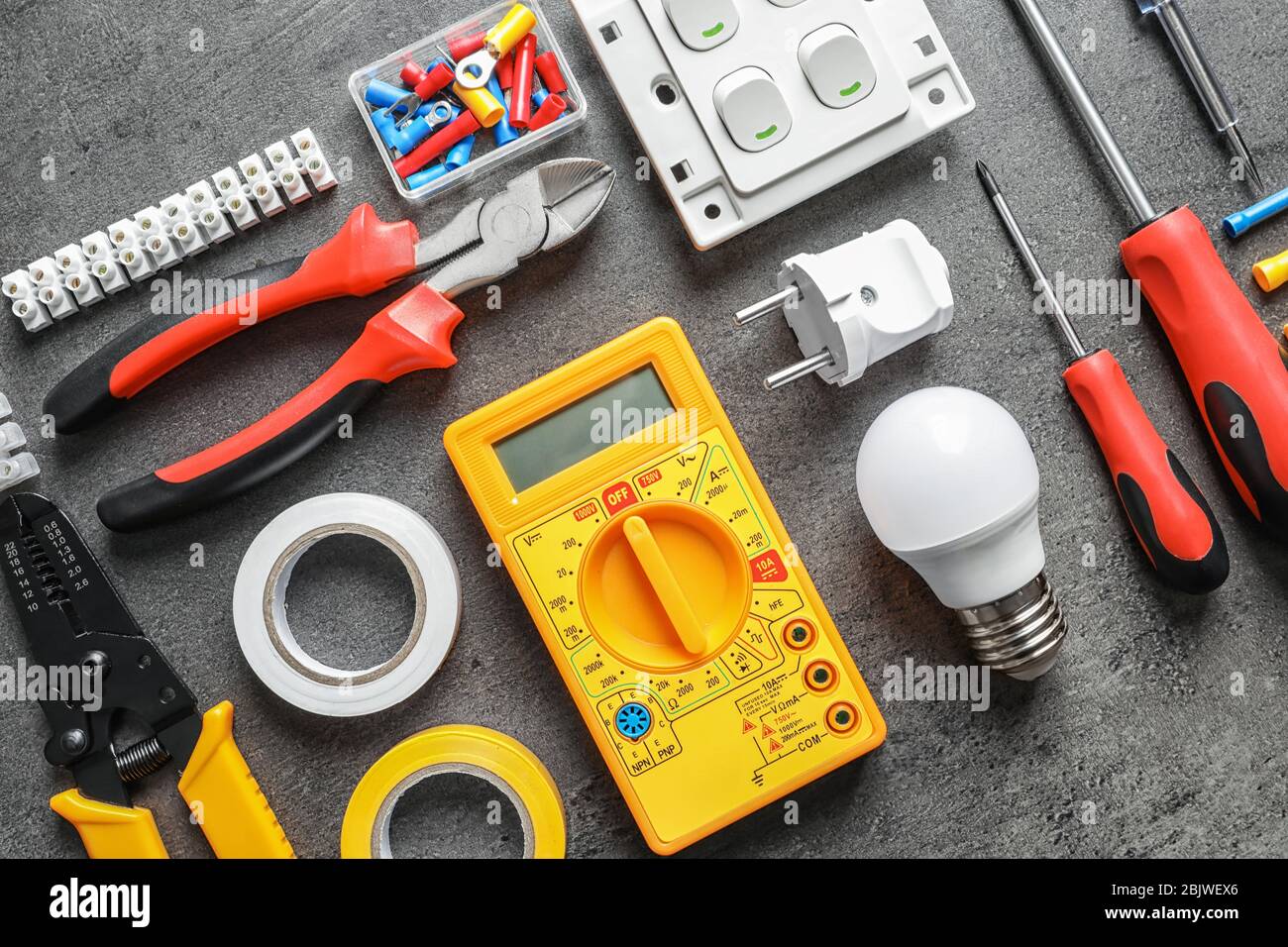 Different electrical tools on grey background Stock Photo