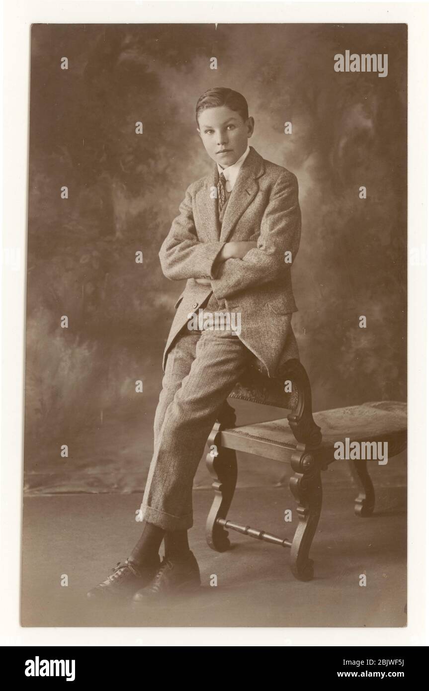 Early 1900's image of boy, teenage years, wearing a tweed single-breasted suit, rounded collar, circa 1919, Brondesbury, N.W. London, England, U.K. Stock Photo
