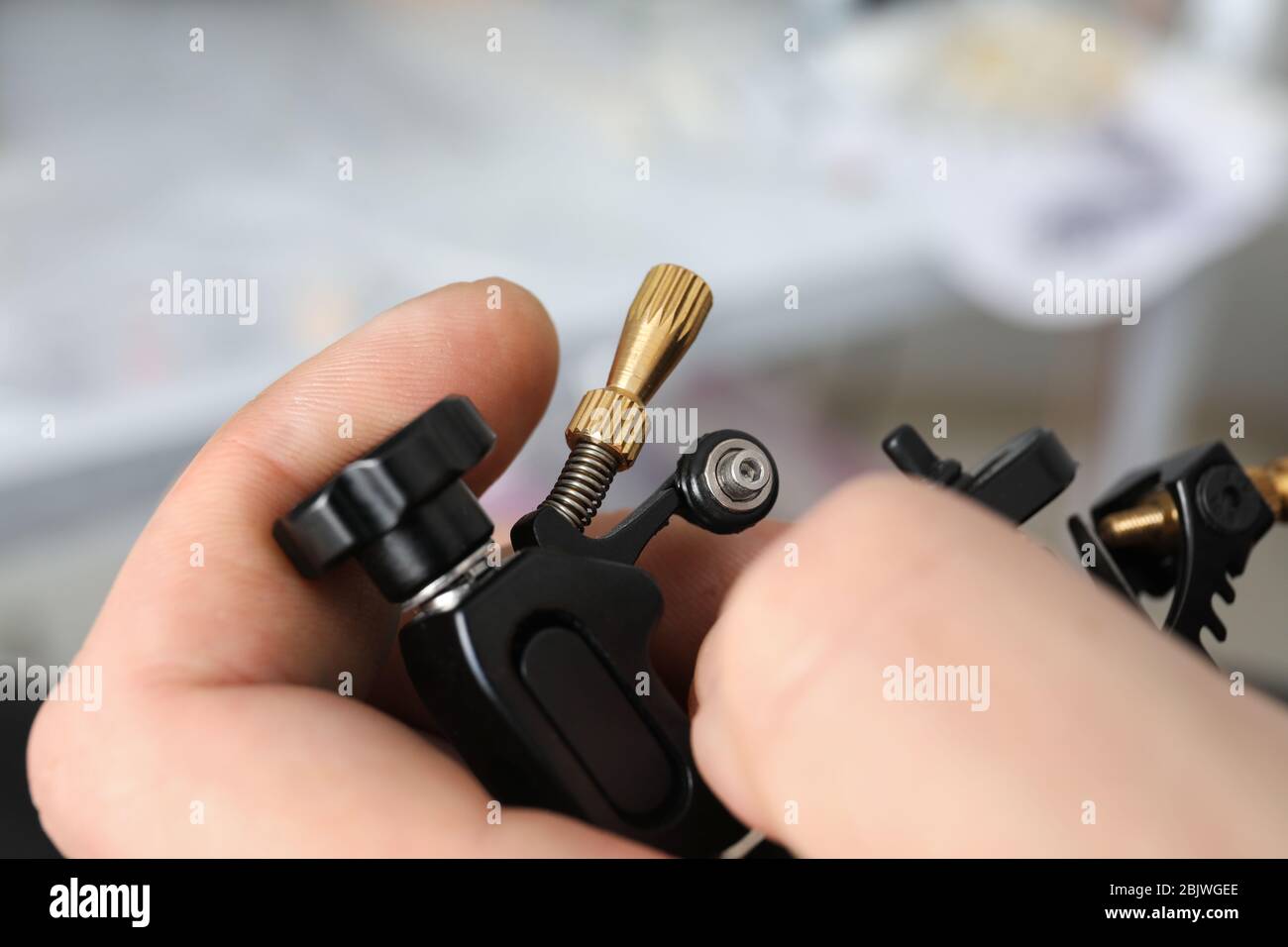 Professional tattoo artist with machine, closeup Stock Photo Alamy
