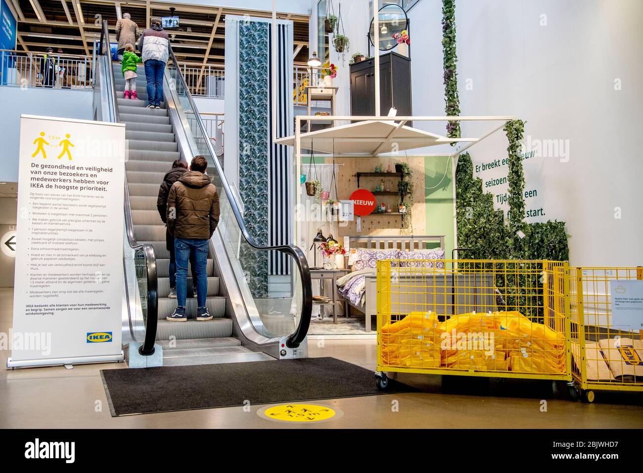 Customers using the escalator at a social distance during the reopening.The IKEA stores closed on their own initiative in March due to the corona virus threats, the furniture store is opening