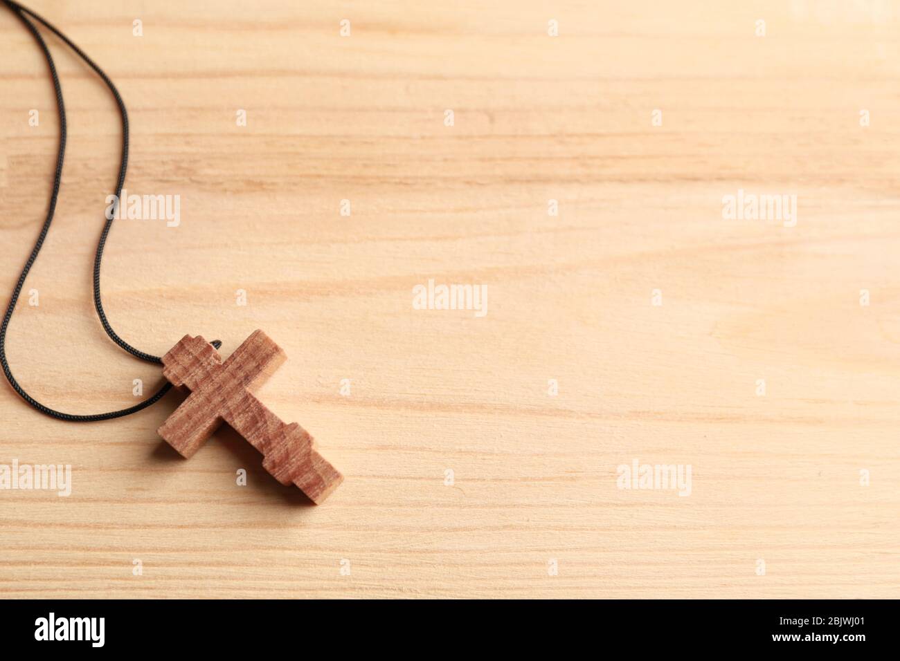 Cross on wooden background Stock Photo - Alamy