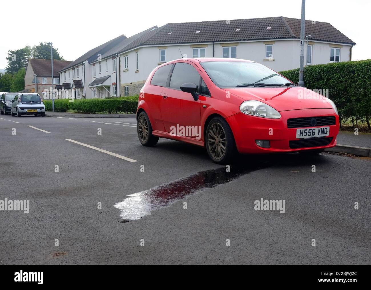 April 2020 - Oil leaking out of an old Fiat Punto. Stock Photo