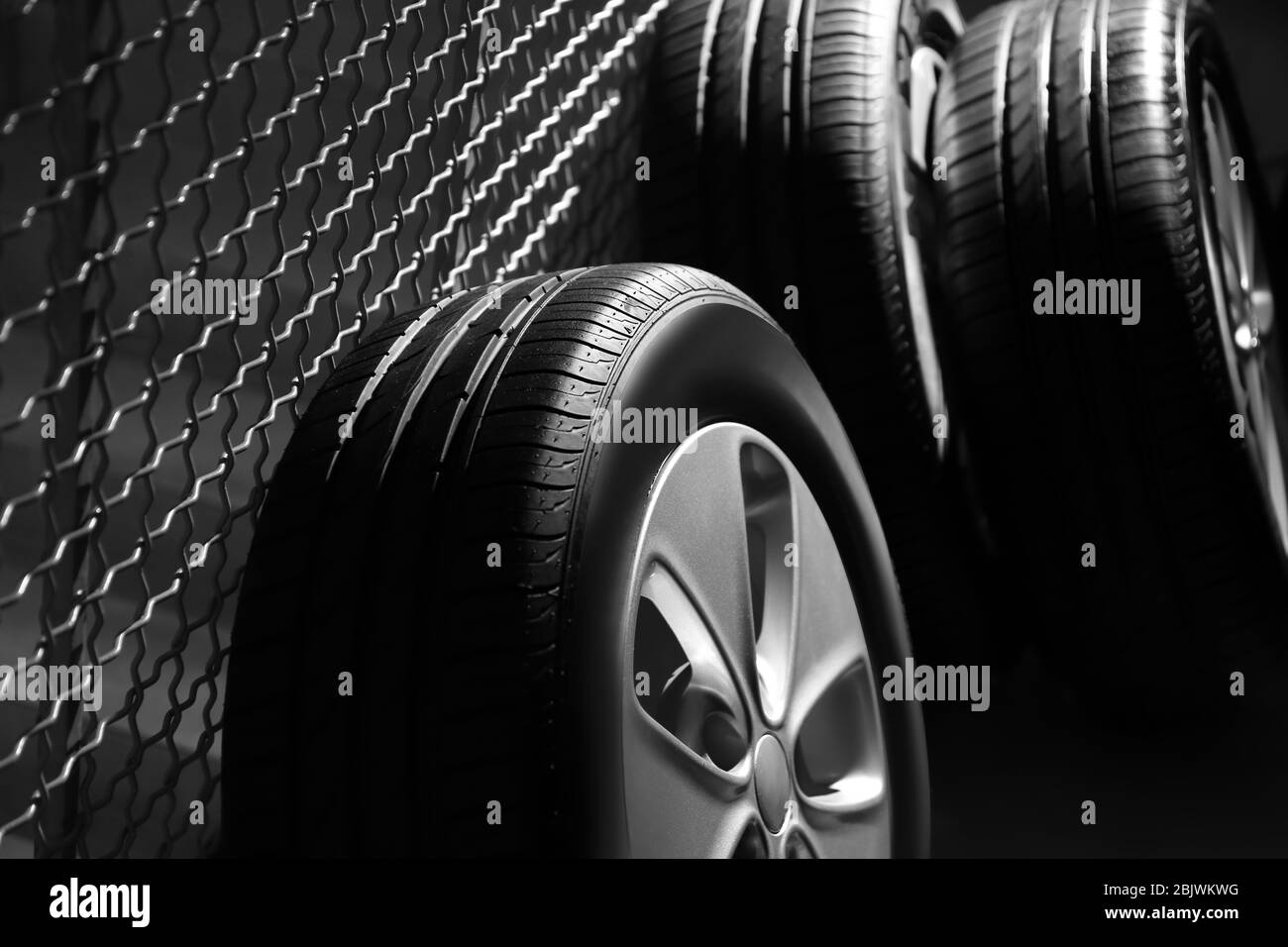 Car tires with rims indoors Stock Photo Alamy