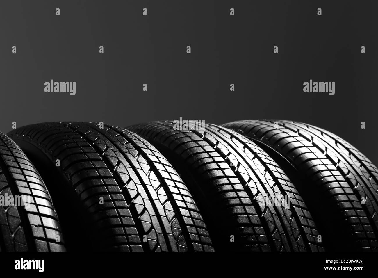 Car tires on grey background Stock Photo Alamy