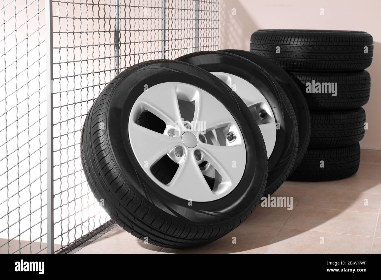 Car tires with rims in automobile service center Stock Photo Alamy