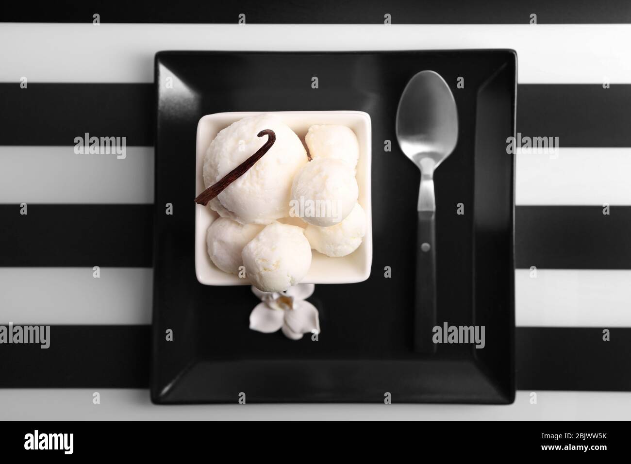 Bowl with delicious vanilla ice cream on table Stock Photo - Alamy