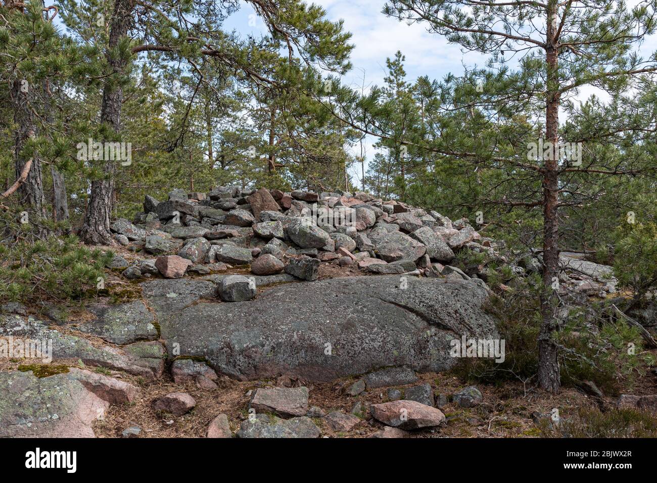 Hiidenkiuas, pre-historic cairn grave, along the Hanikka hike trail iin Espoo, Finland Stock Photo