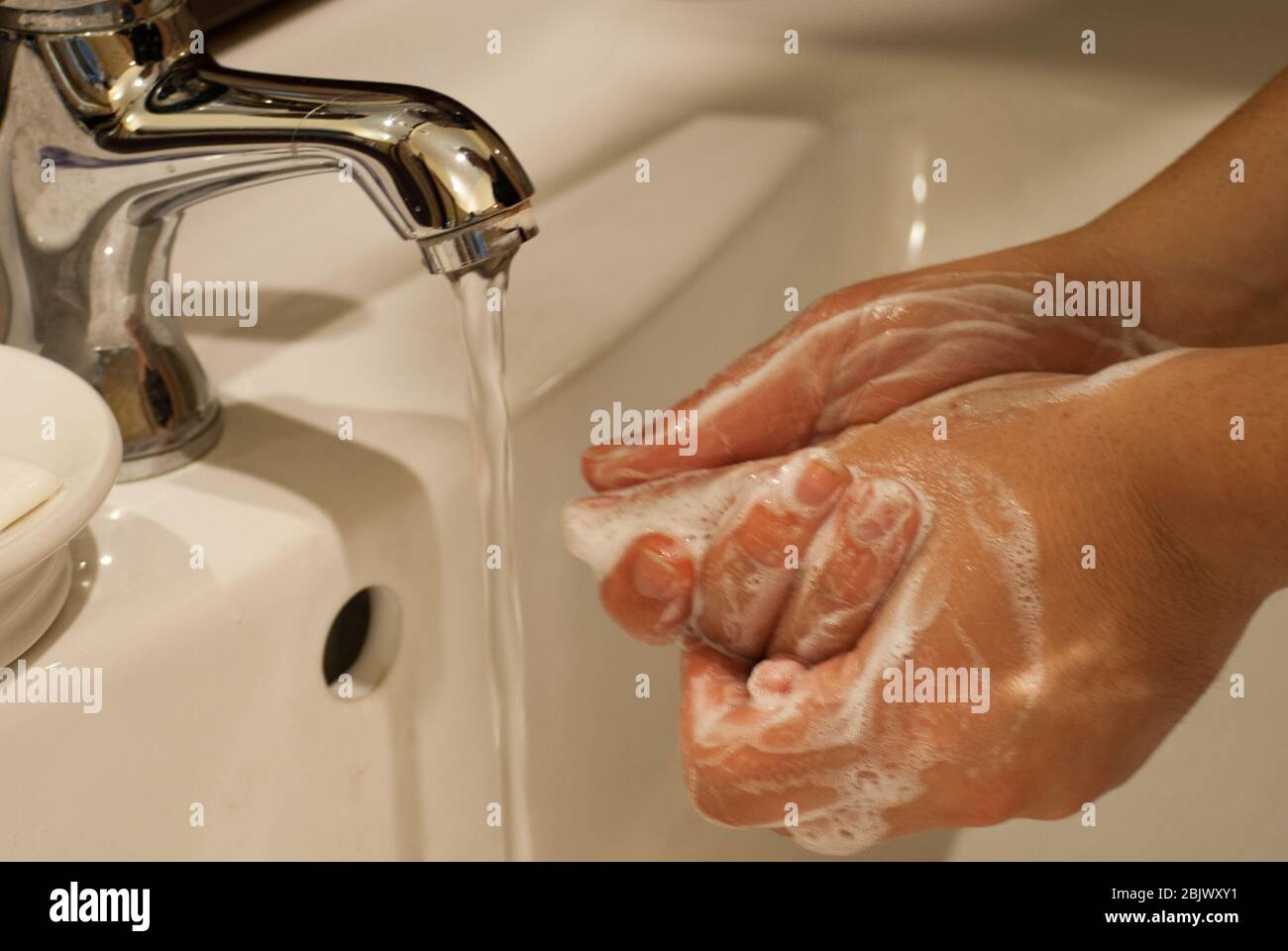 Washing hands carefully: one of the best way to prevent coronavirus transmission. Stock Photo