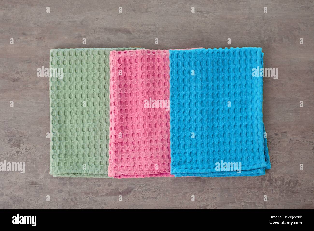 Clean kitchen towels on table, top view Stock Photo - Alamy