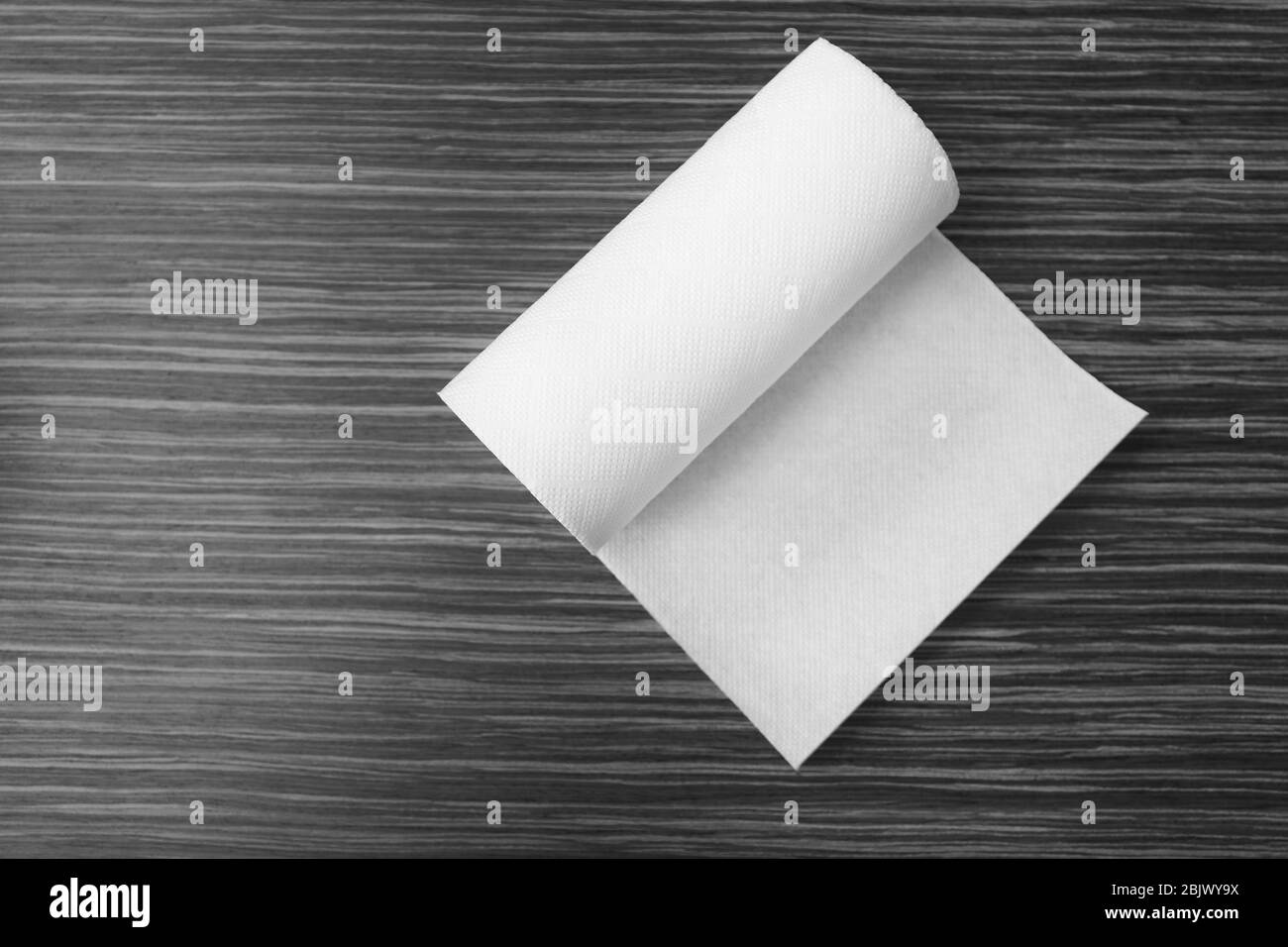 Roll of paper towels on table, top view Stock Photo