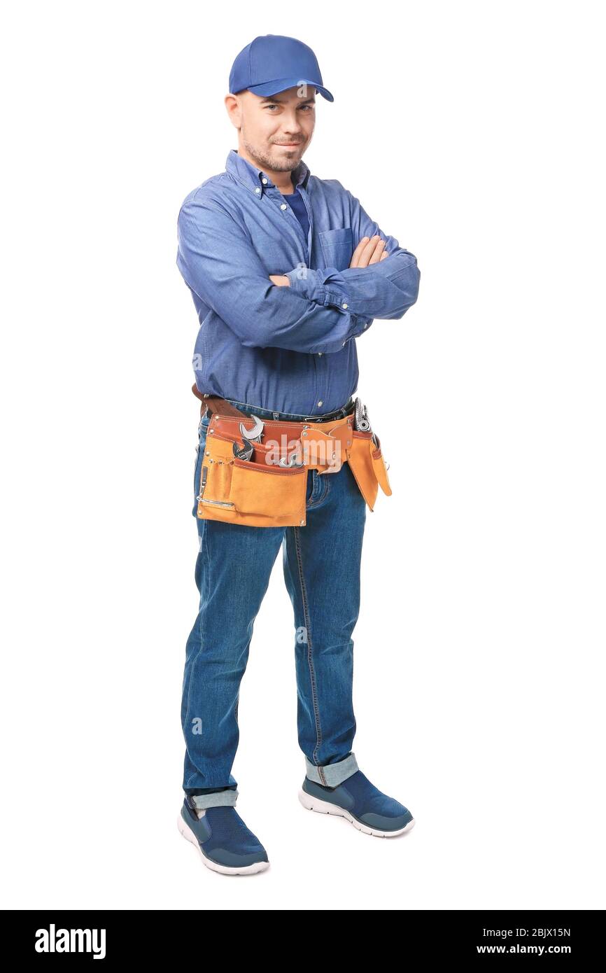 Plumber with tool belt on white background Stock Photo
