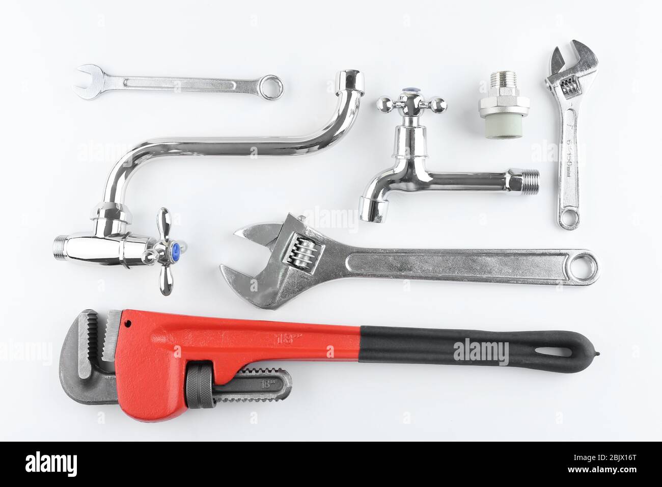 Plumber's items on white background Stock Photo - Alamy