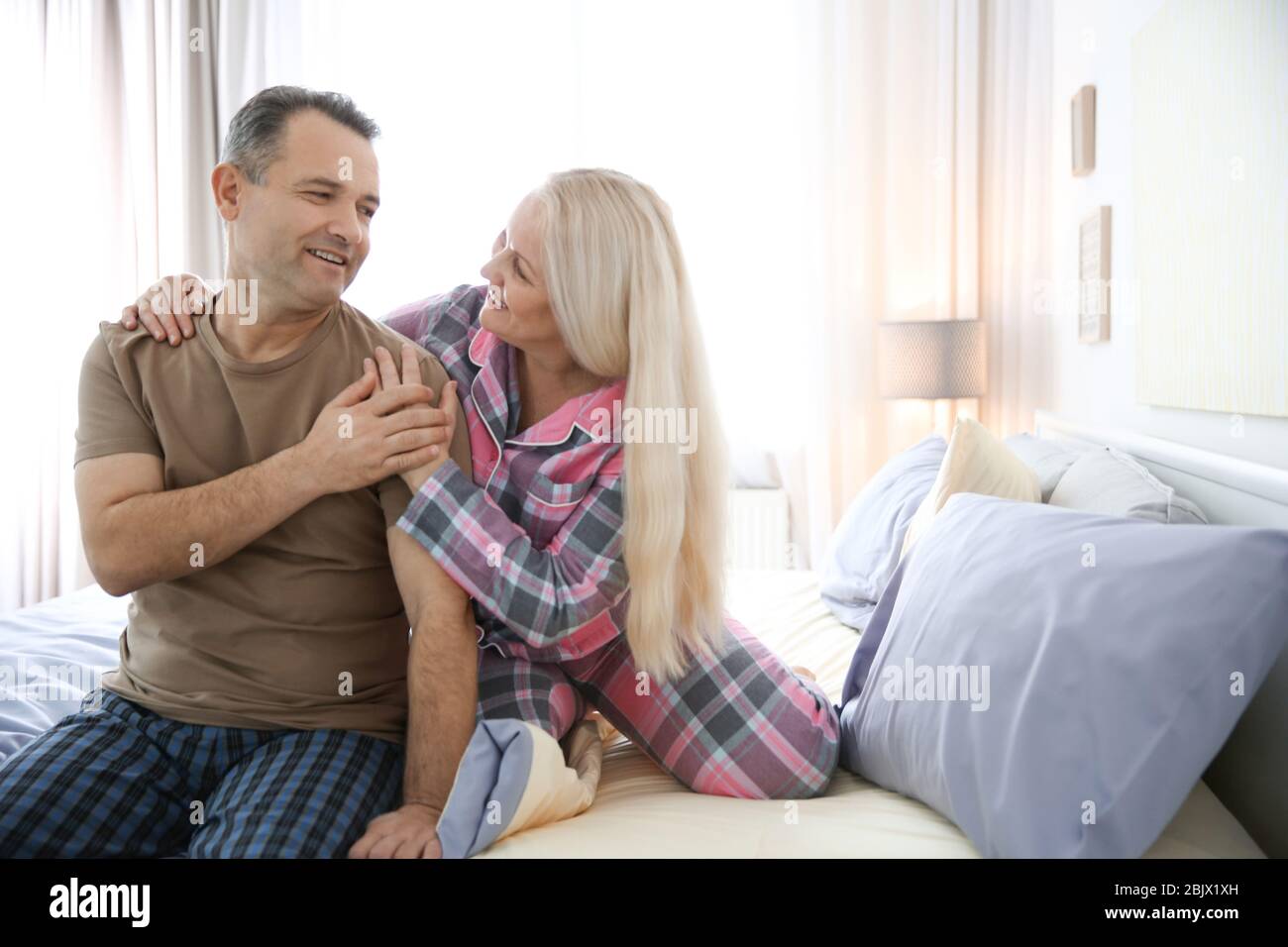 Couple middle age bed hi-res stock photography and images - Alamy