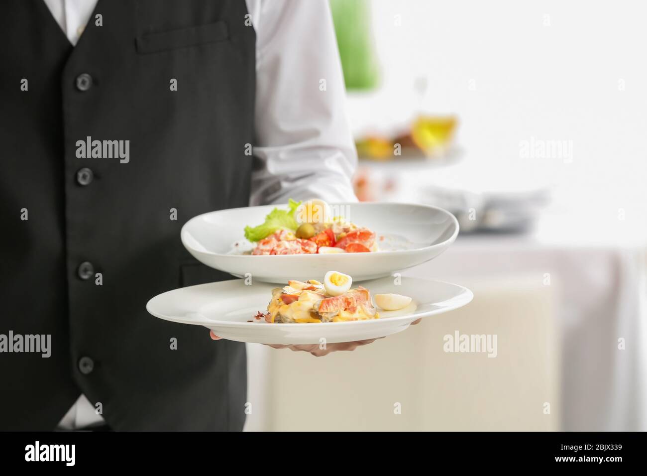 Waiter holding plates hires stock photography and images Alamy