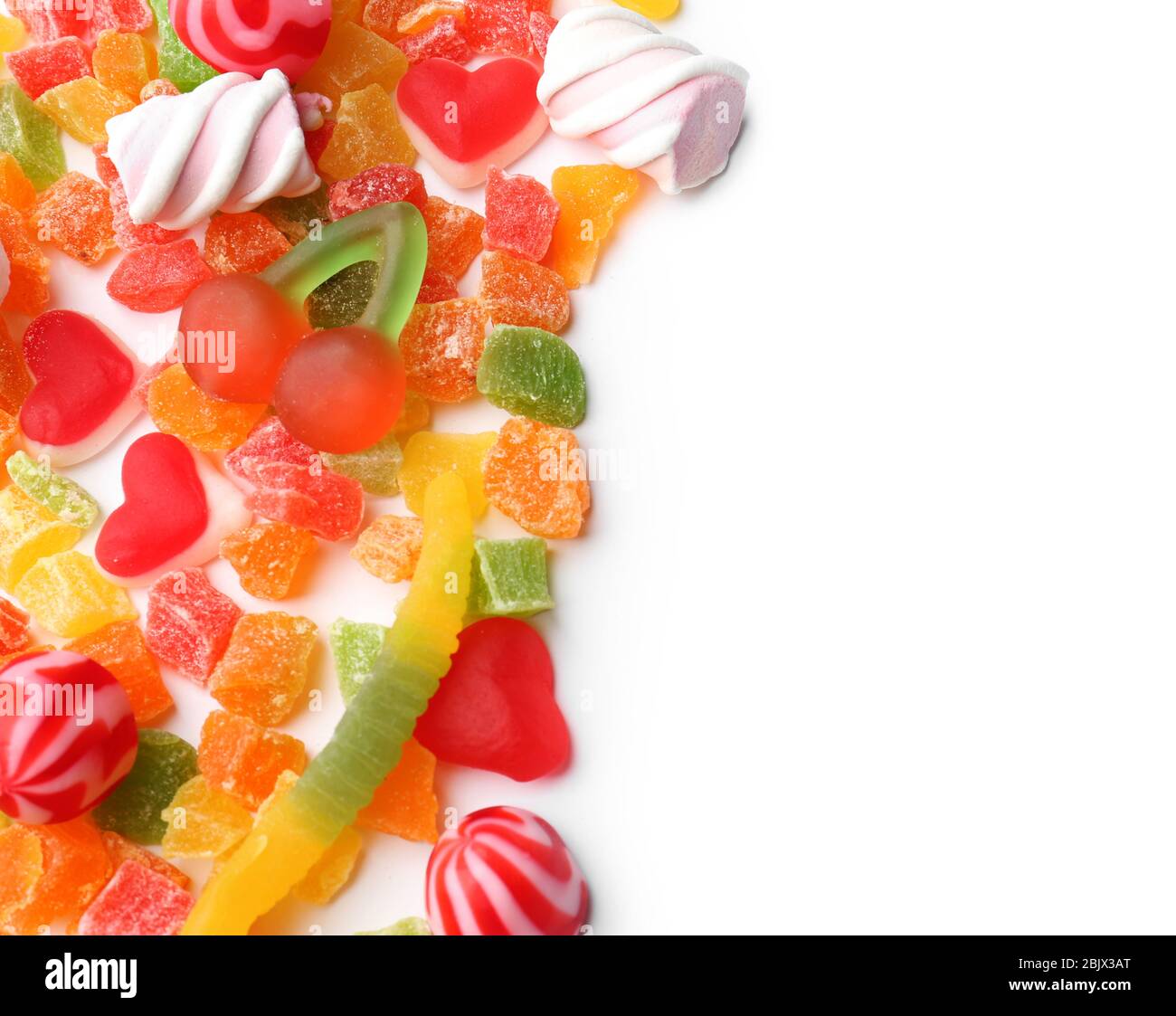 Different colorful candies on white background Stock Photo - Alamy