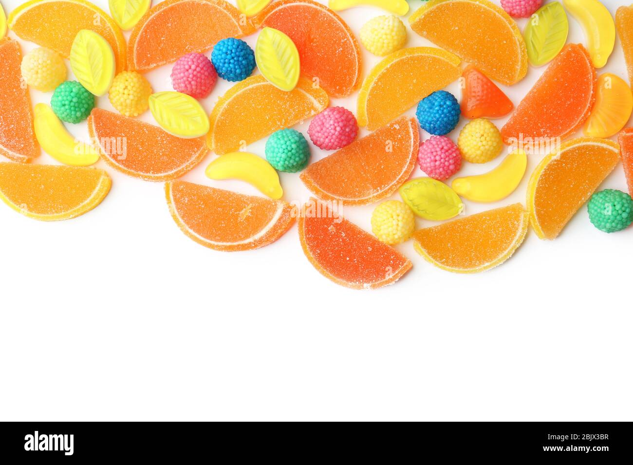 Different colorful candies on white background Stock Photo - Alamy