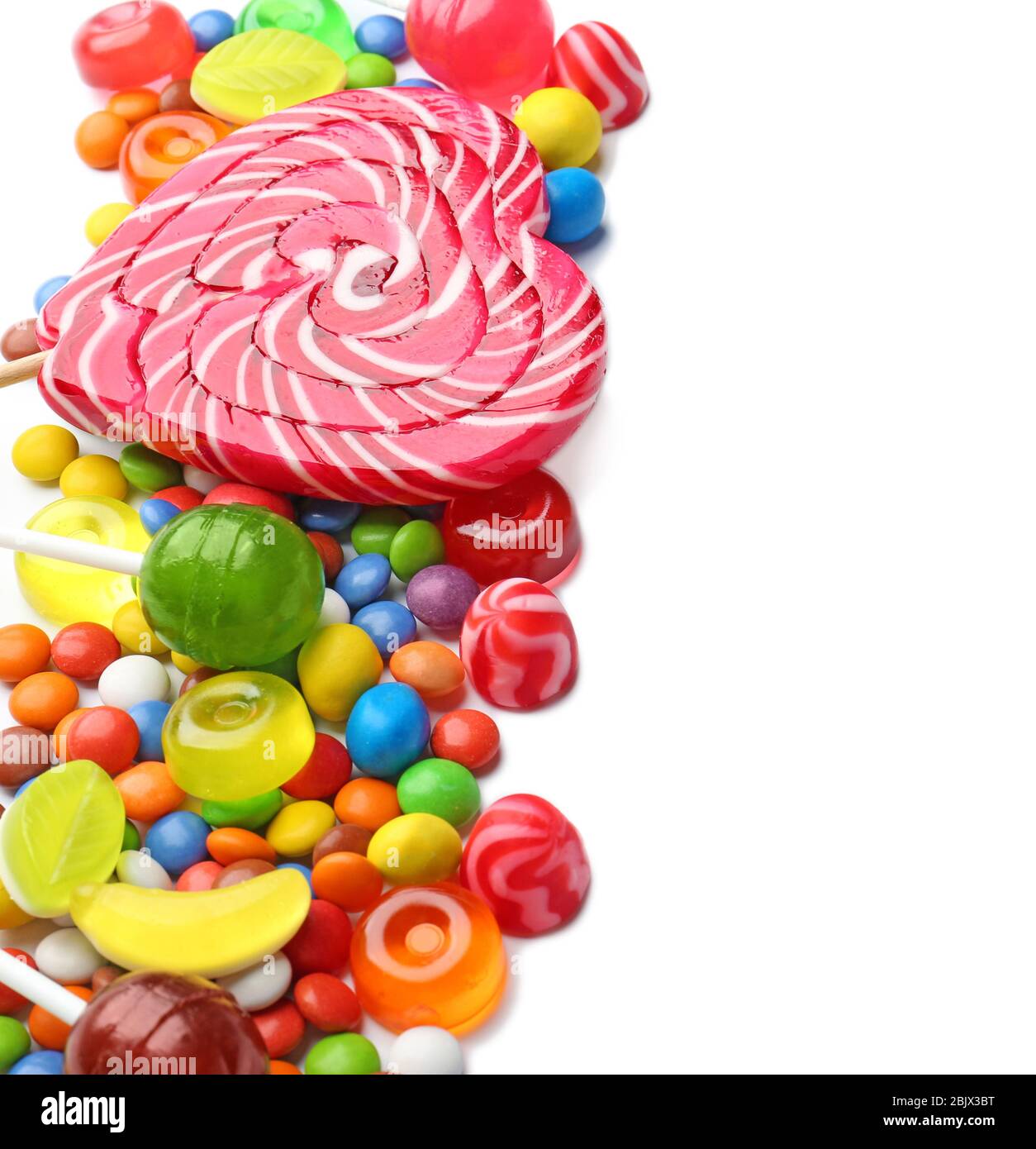 Different colorful candies on white background Stock Photo - Alamy