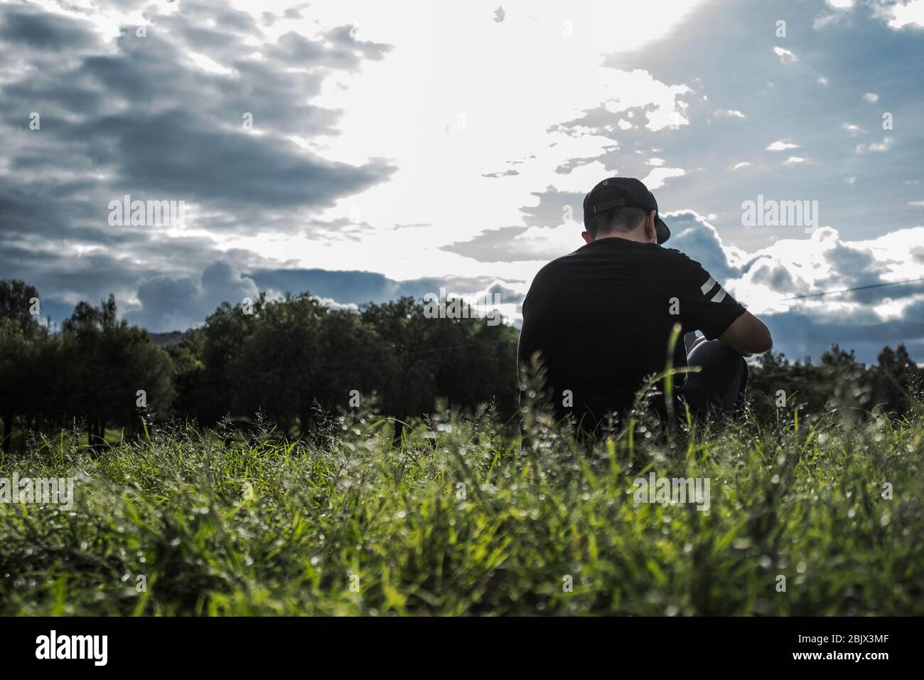 A man thinking with a landscape in the bottom Stock Photo