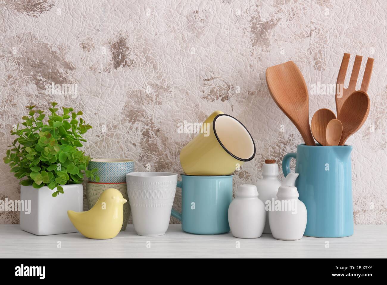 Cups and different cooking utensils on table Stock Photo Alamy