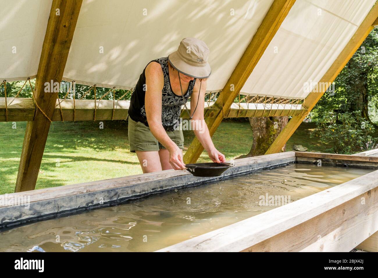 Woman gold panning, Yale Historic Site ???Tent City??? reminiscent of the
