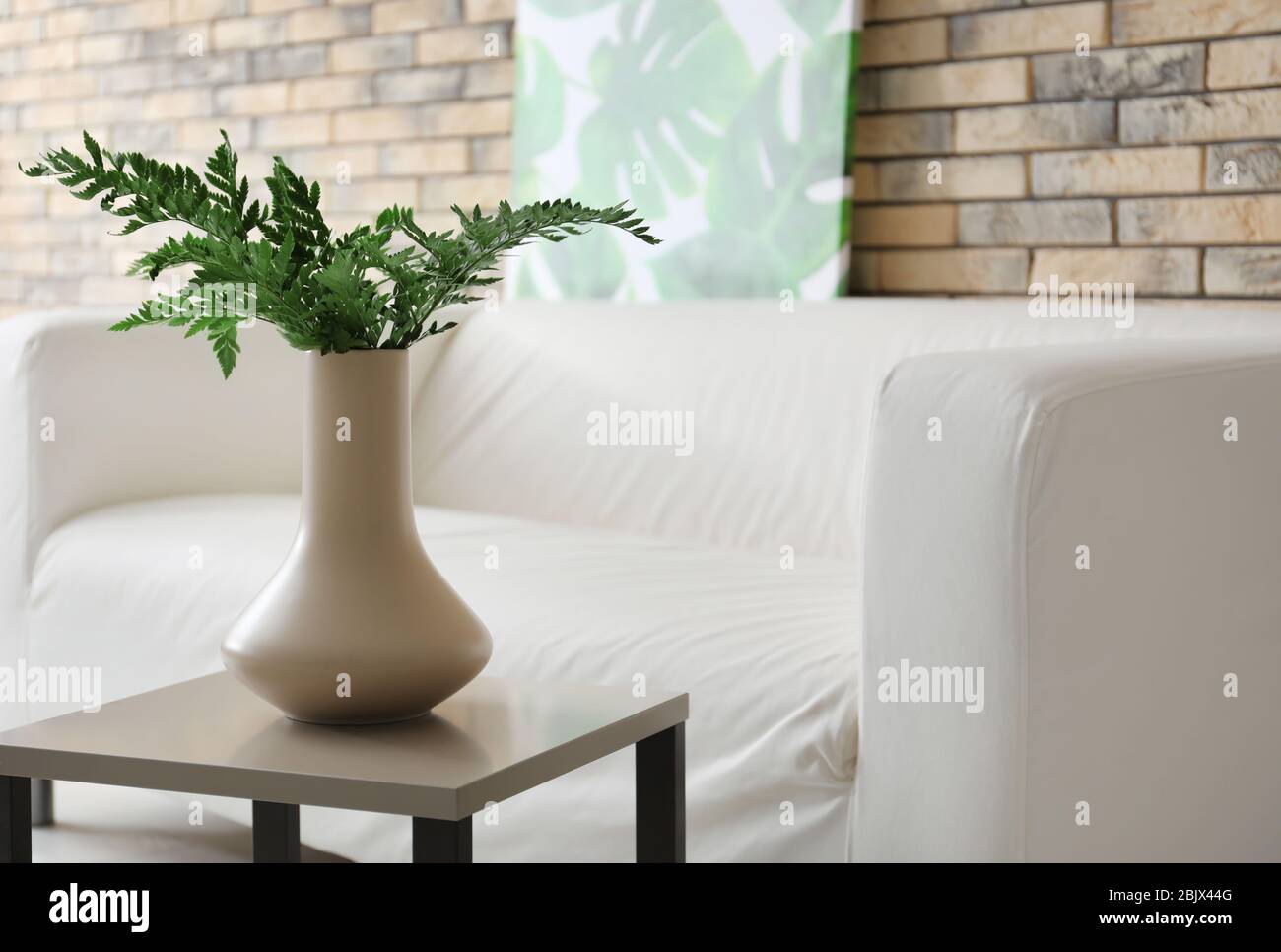 Interior of modern room with stylish sofa and table Stock Photo - Alamy