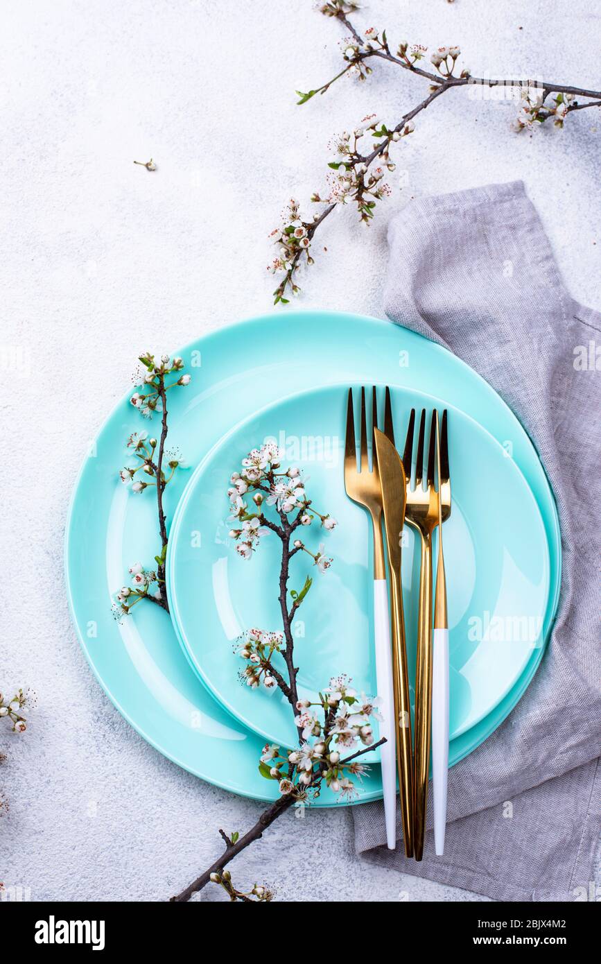 Spring table setting with blooming branch Stock Photo